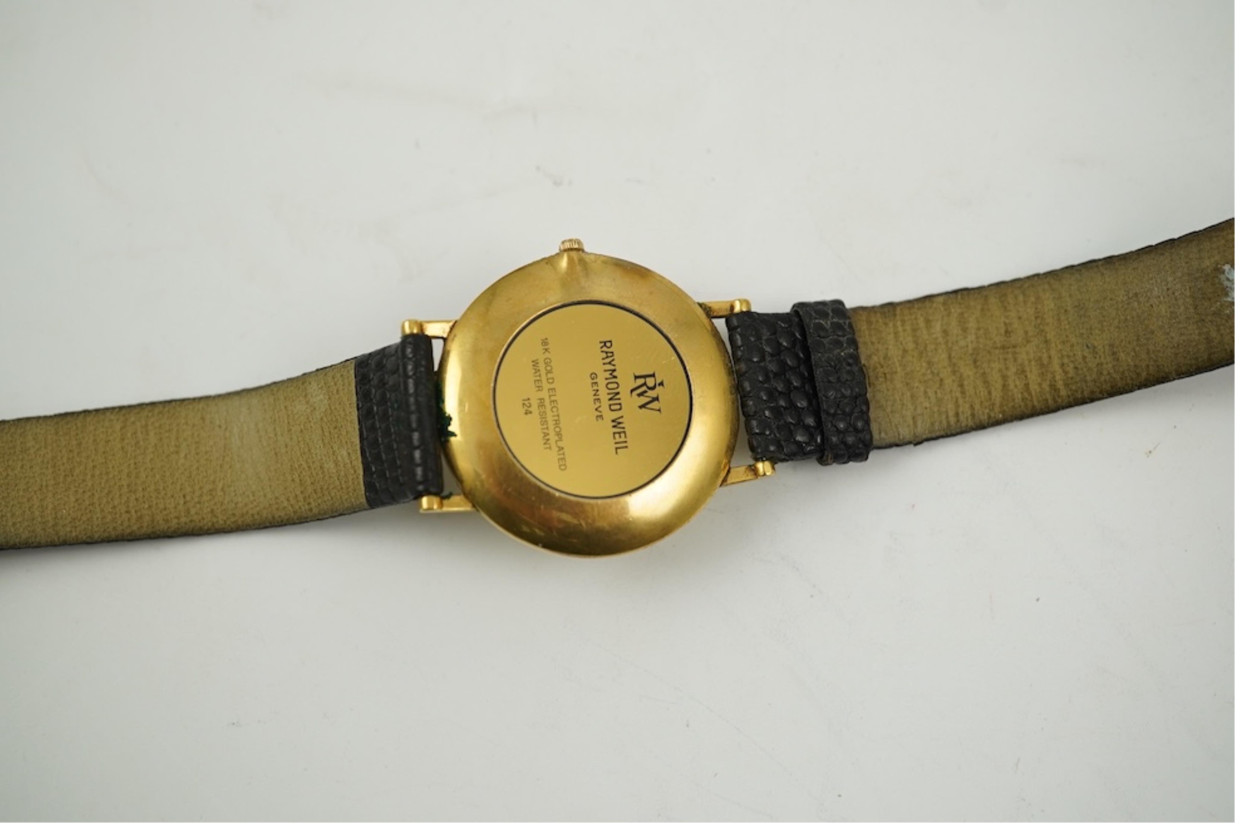 A gentleman's recent 18k gold electro-plated Raymond Weil quartz dress wrist watch, case diameter 33mm and a similar Gucci quartz dress wrist watch.